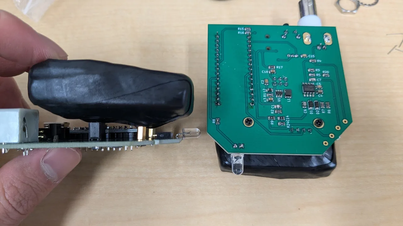 Holding the scintillator block in a hand and connecting it to the main board