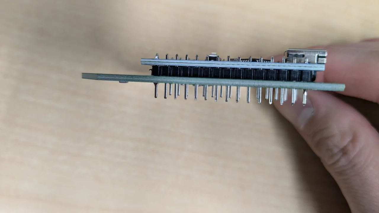 Side view of an Arduino Nano plugged into the board