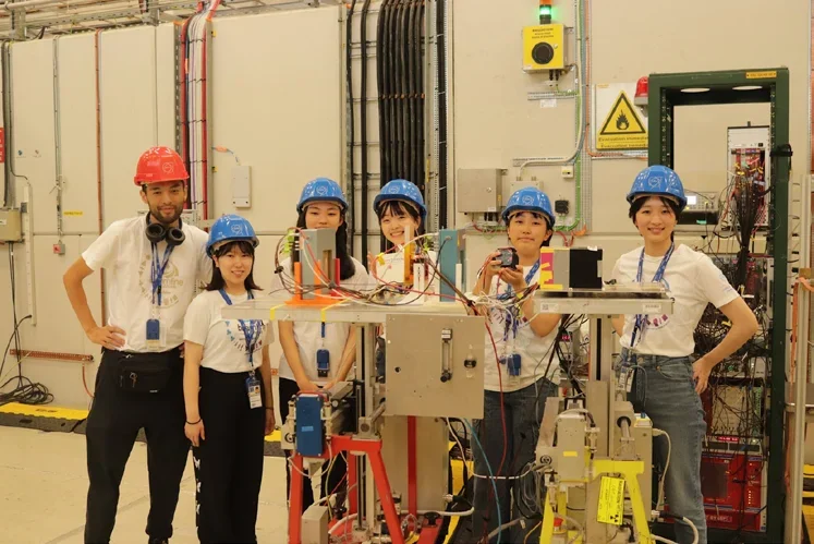 Sakura Particles team in helmets at CERN
