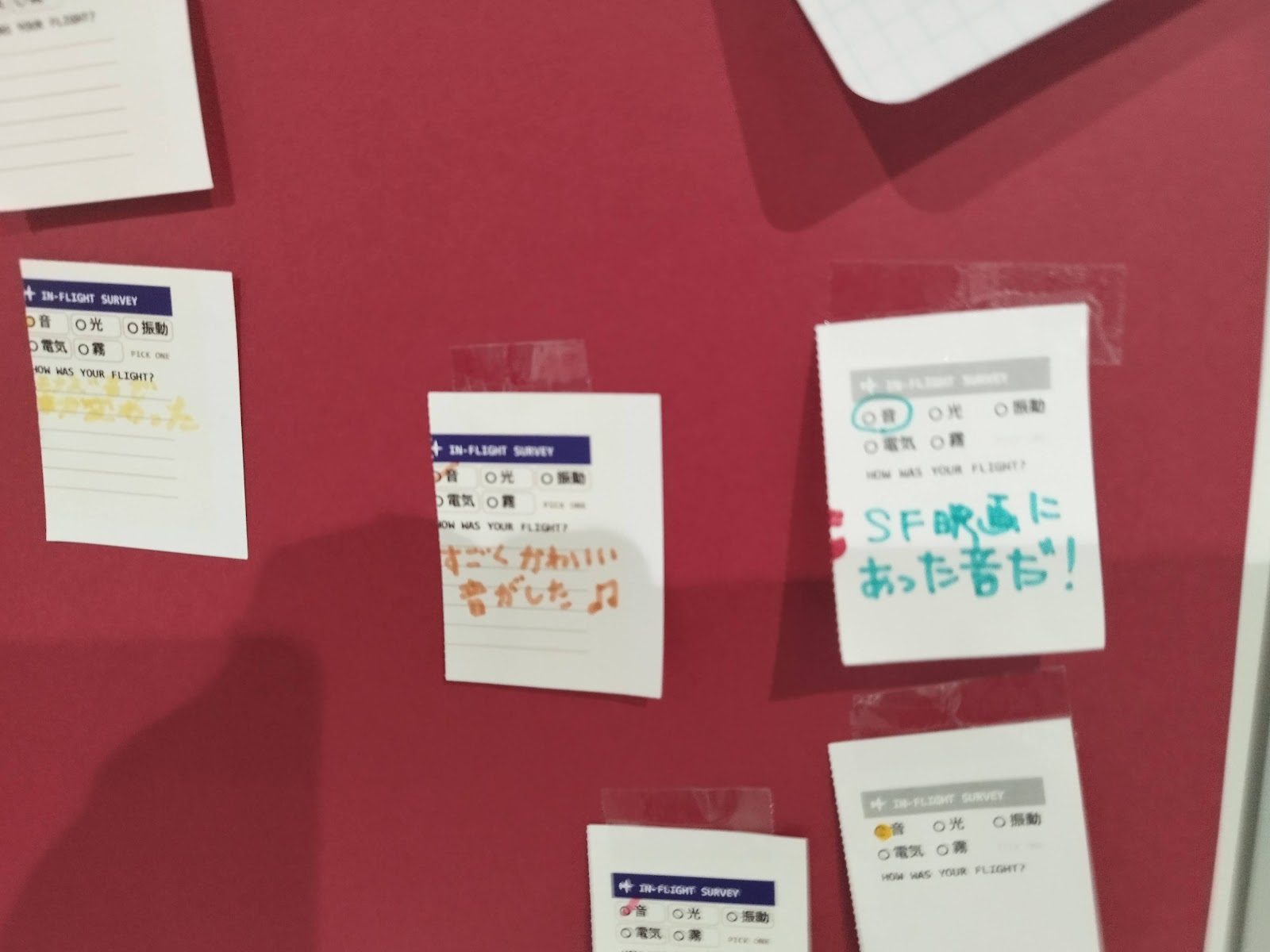 Stubs pinned to the red sound board, with handwritten comments about the sci-fi tone