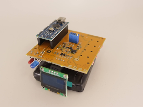 The new detector in the flesh: a microcontroller and OLED display mounted on top of the scintillator box.