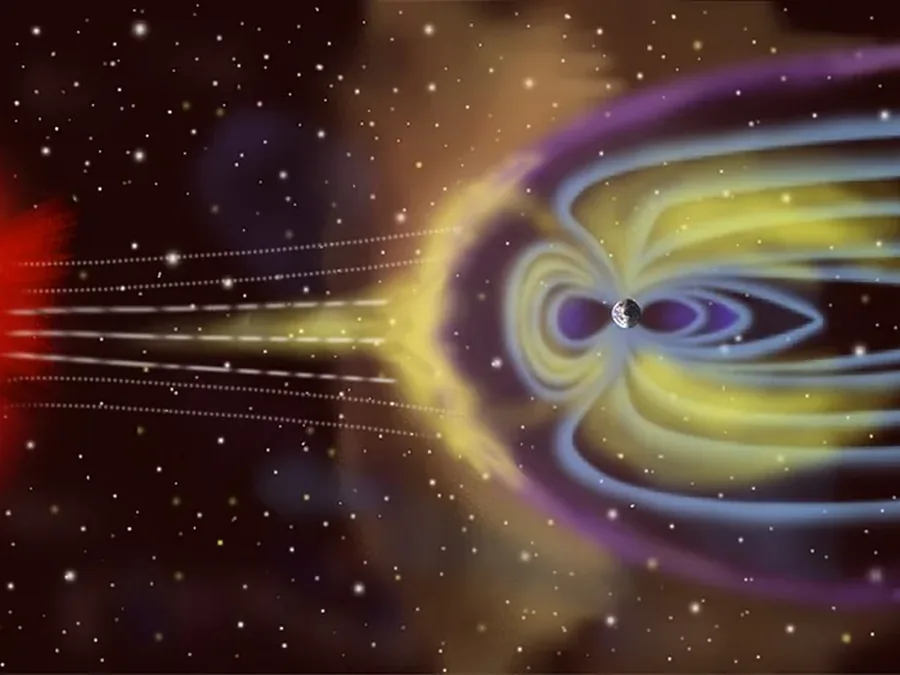 太陽から吹く風を受け、地球のまわりにとり巻く磁力線の想像図(NASA)